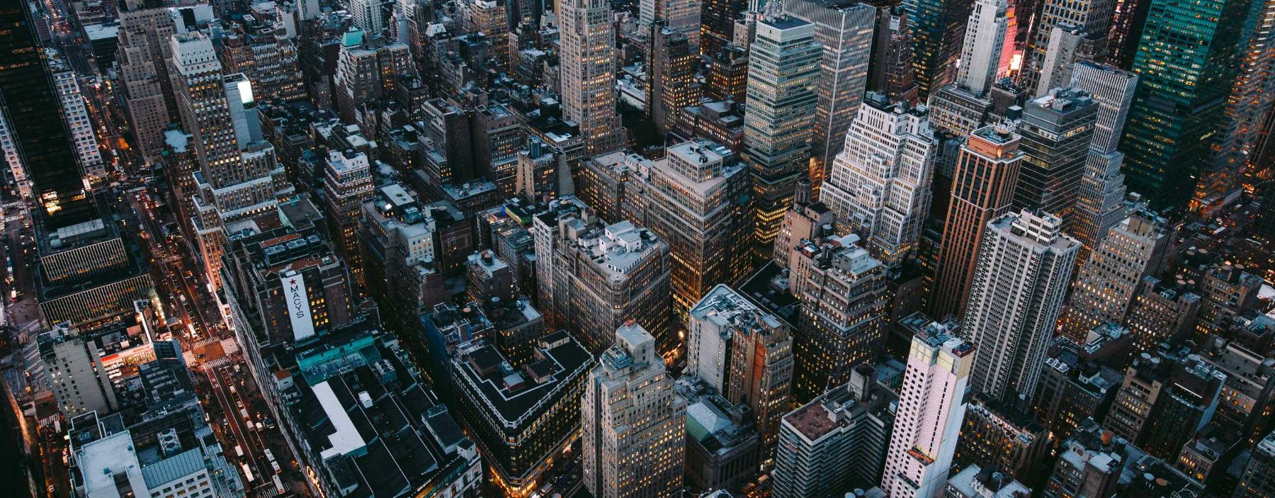 Aerial view of a dense city at dusk