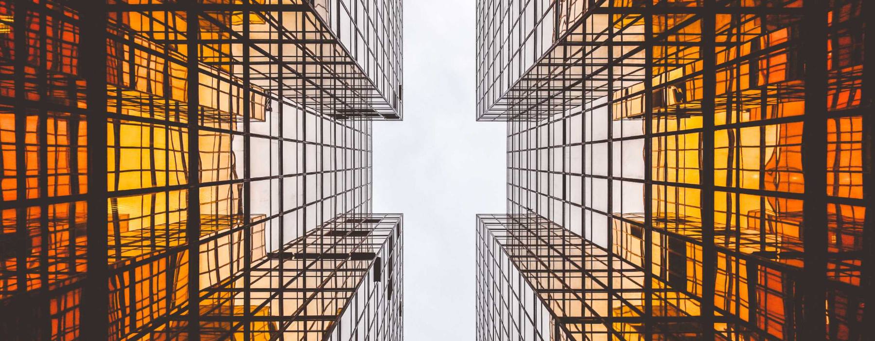 Looking up at a glass office tower